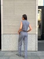 Костюм жилет с клапанами брюки палаццо